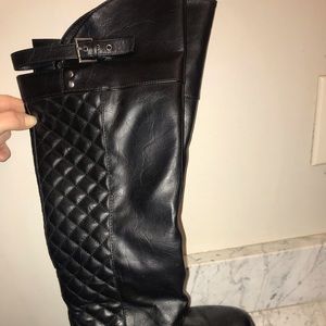 Black tall boots with buckle
